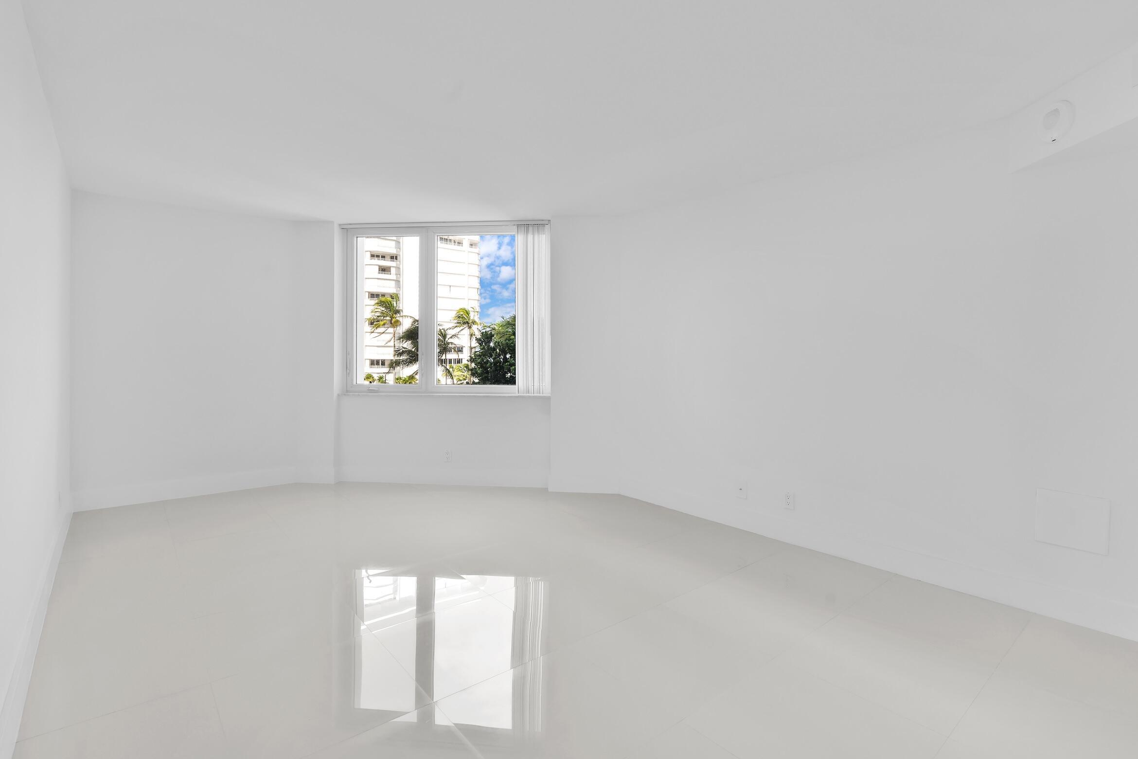 550 South Ocean Boulevard, Unit 403 Boca Raton, FL 33432 - Photo 18 of 55 an empty room with windows