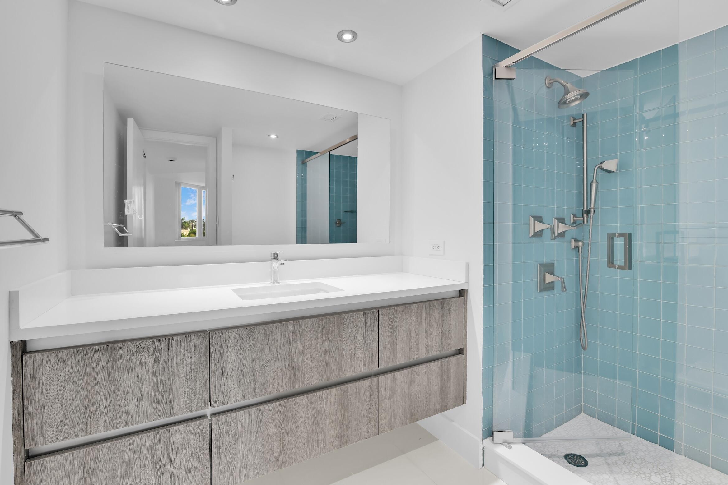 550 South Ocean Boulevard, Unit 403 Boca Raton, FL 33432 - Photo 19 of 55 a bathroom with a sink and a mirror