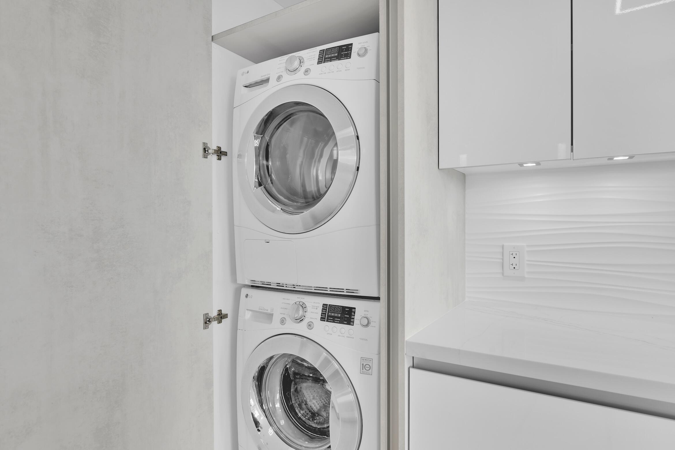 550 South Ocean Boulevard, Unit 403 Boca Raton, FL 33432 - Photo 21 of 55 a utility room with dryer and washer