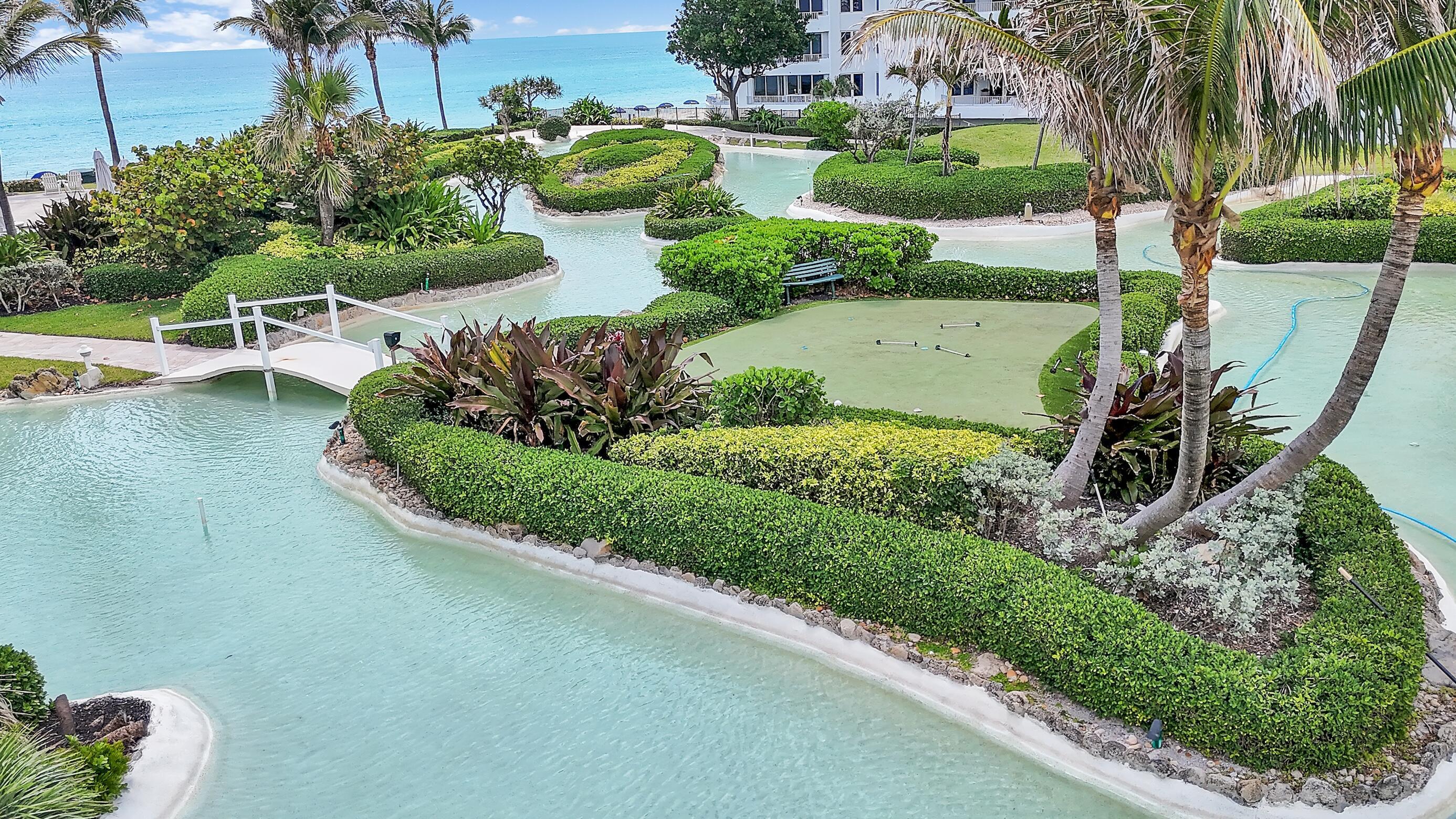 550 South Ocean Boulevard, Unit 403 Boca Raton, FL 33432 - Photo 24 of 55 an aerial view of a house with a yard and lake view