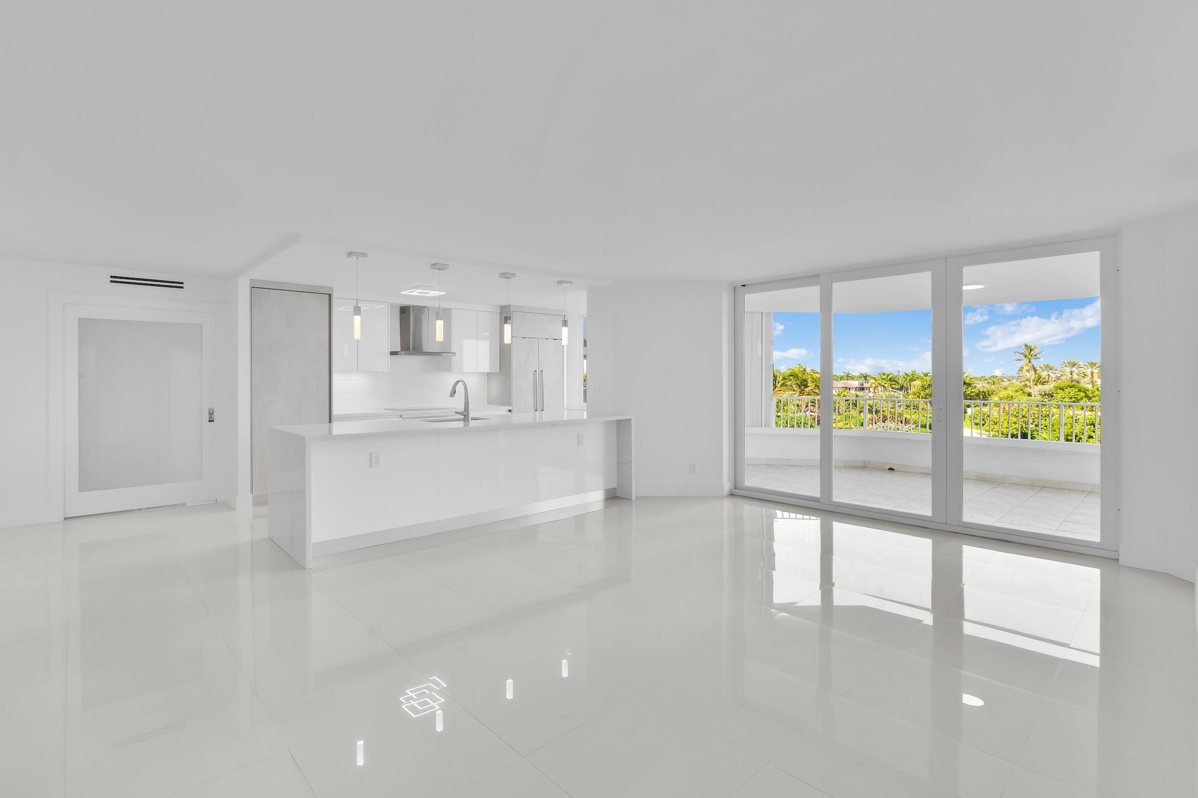 550 South Ocean Boulevard, Unit 403 Boca Raton, FL 33432 - Photo 4 of 55 a view of kitchen with wooden floor and outdoor space