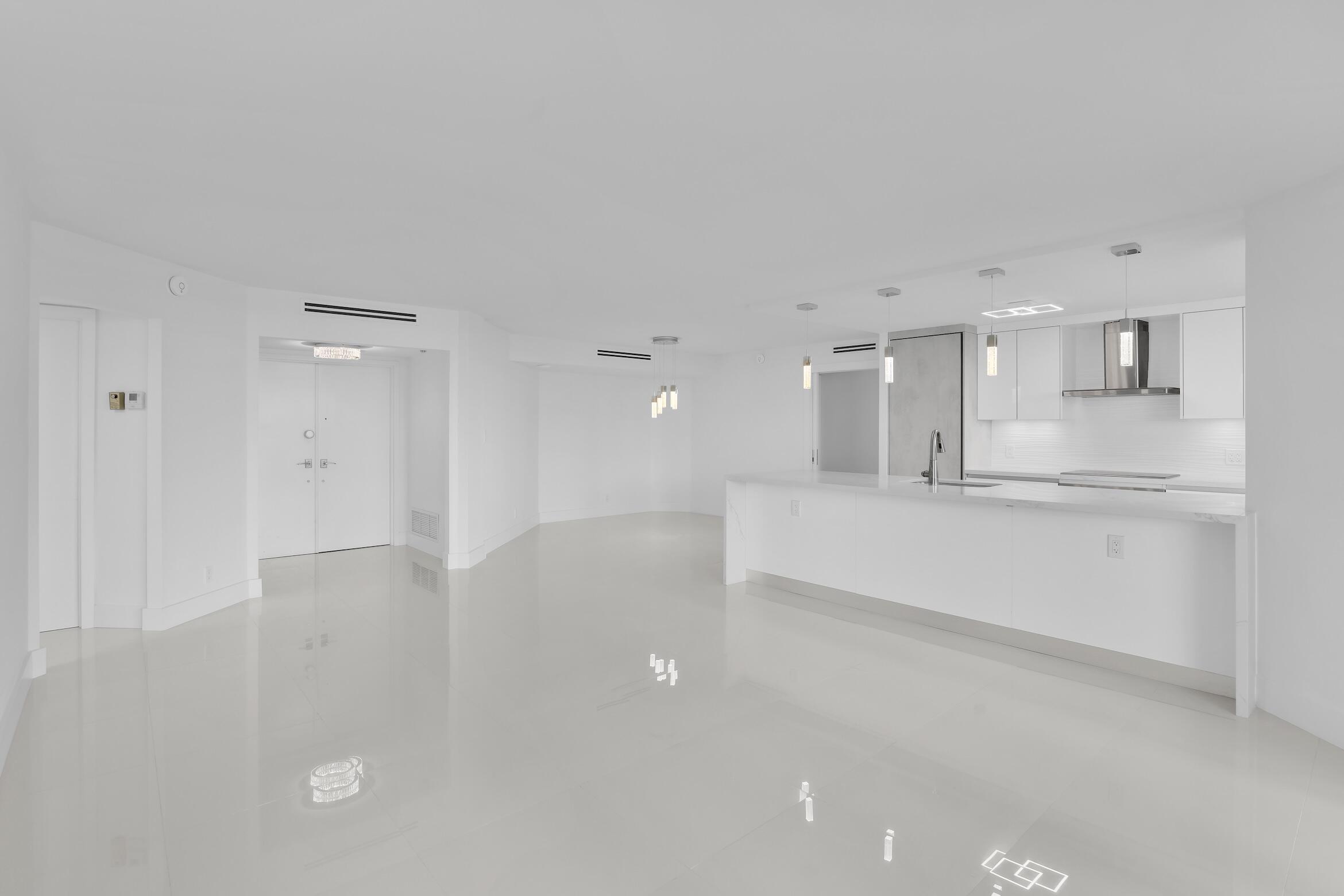 550 South Ocean Boulevard, Unit 403 Boca Raton, FL 33432 - Photo 6 of 55 a view of a kitchen with white cabinets
