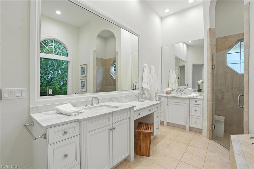 2547 Avila Lane Naples, FL 34105 - Photo 17 of 49 a bathroom with a granite countertop sink mirror and