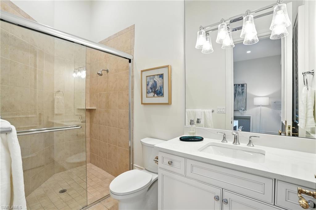 2547 Avila Lane Naples, FL 34105 - Photo 31 of 49 a bathroom with a sink a toilet and shower