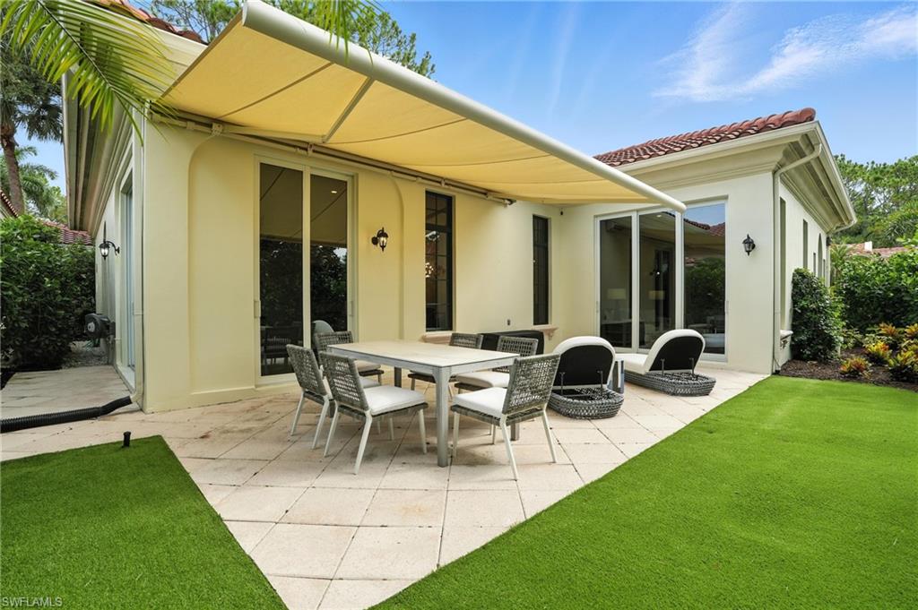2547 Avila Lane Naples, FL 34105 - Photo 36 of 49 a view of outdoor space yard deck patio and outdoor kitchen