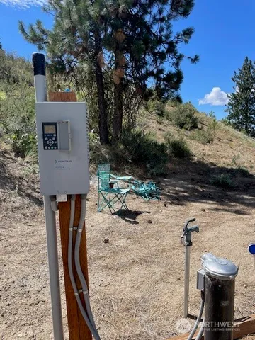 a view of a terrace with chairs and a fire pit