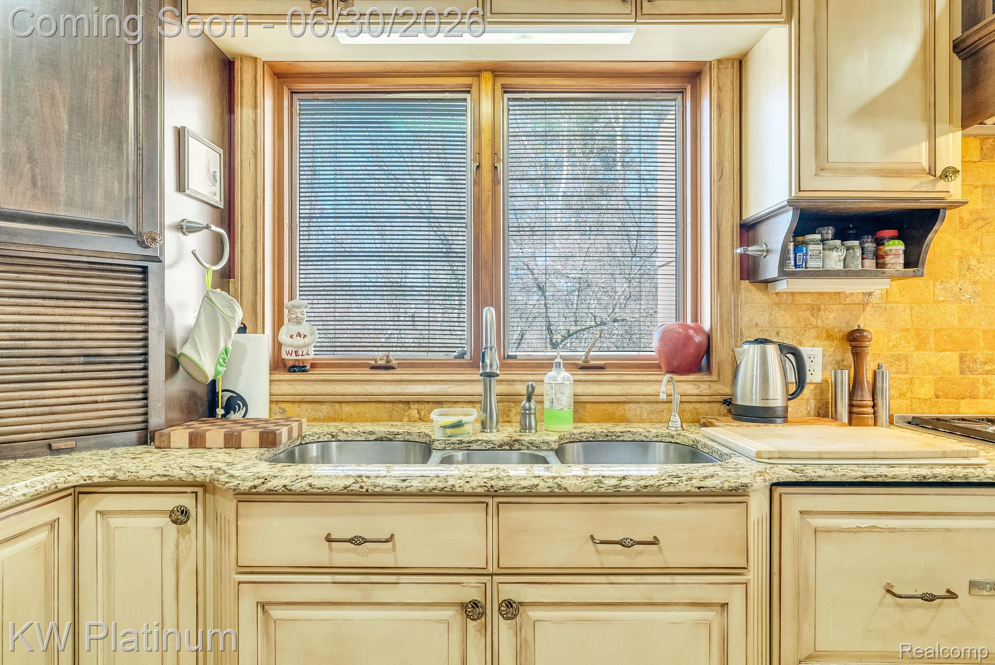 2235 South Lake Shore Road Harbor Beach, MI 48441 - Photo 11 of 99 Kitchen featuring a double stainless steel sink, light-toned granite countertop, and a tiled backsplash