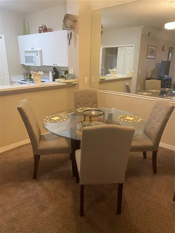 a view of a dining room with furniture