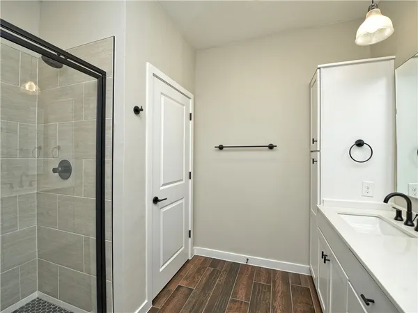 a bathroom with a sink a vanity and a mirror