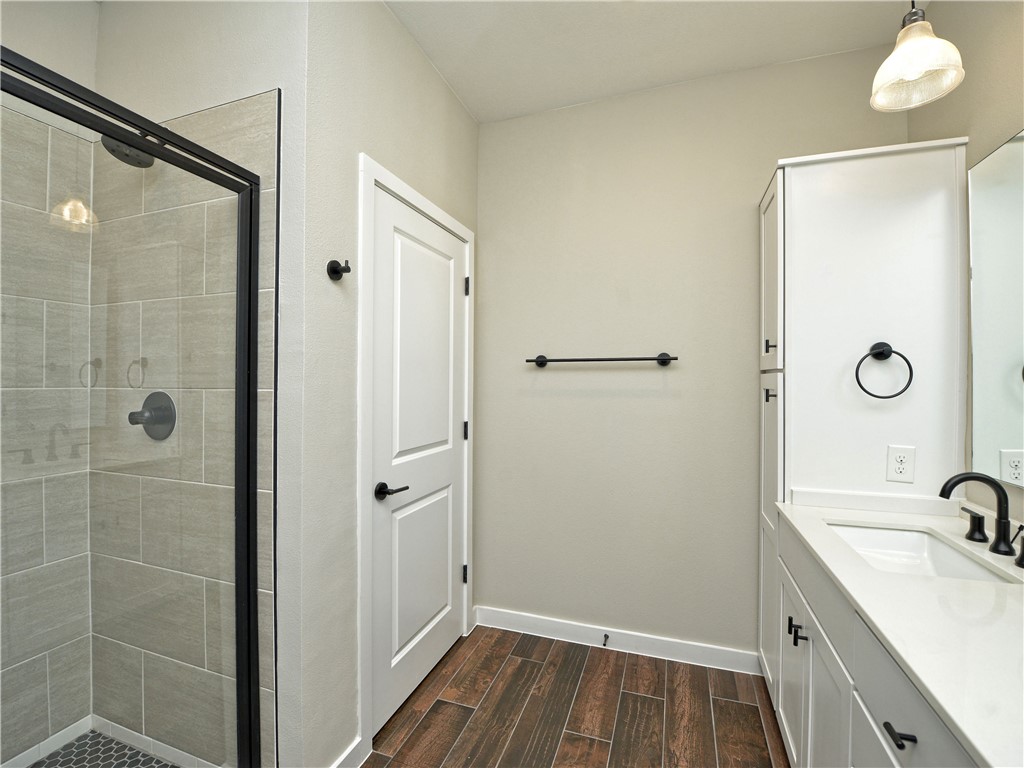 3809 Valley View Road, Unit 15 Austin, TX 78704 - Photo 20 of 30 a bathroom with a sink and a mirror
