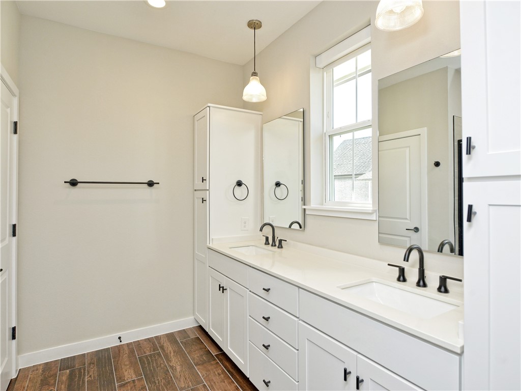 3809 Valley View Road, Unit 15 Austin, TX 78704 - Photo 21 of 30 a bathroom with a sink a vanity and a mirror