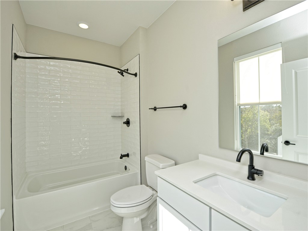 3809 Valley View Road, Unit 15 Austin, TX 78704 - Photo 24 of 30 a bathroom with a sink toilet and shower
