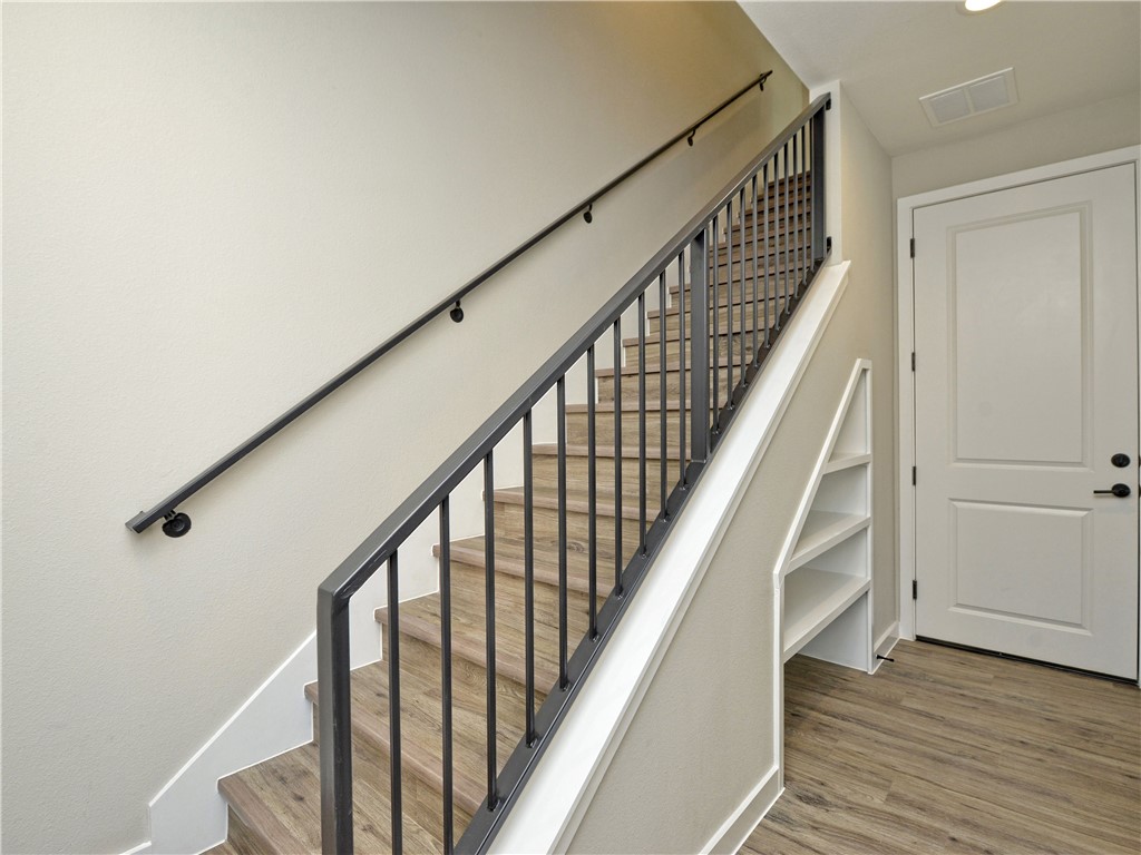 3809 Valley View Road, Unit 15 Austin, TX 78704 - Photo 4 of 30 a view of staircase with wooden floor and white walls