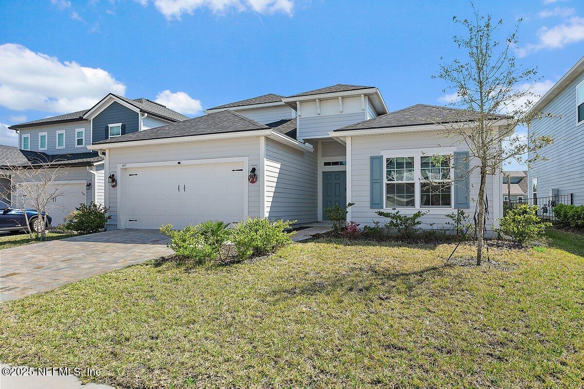 front view of a house with a yard