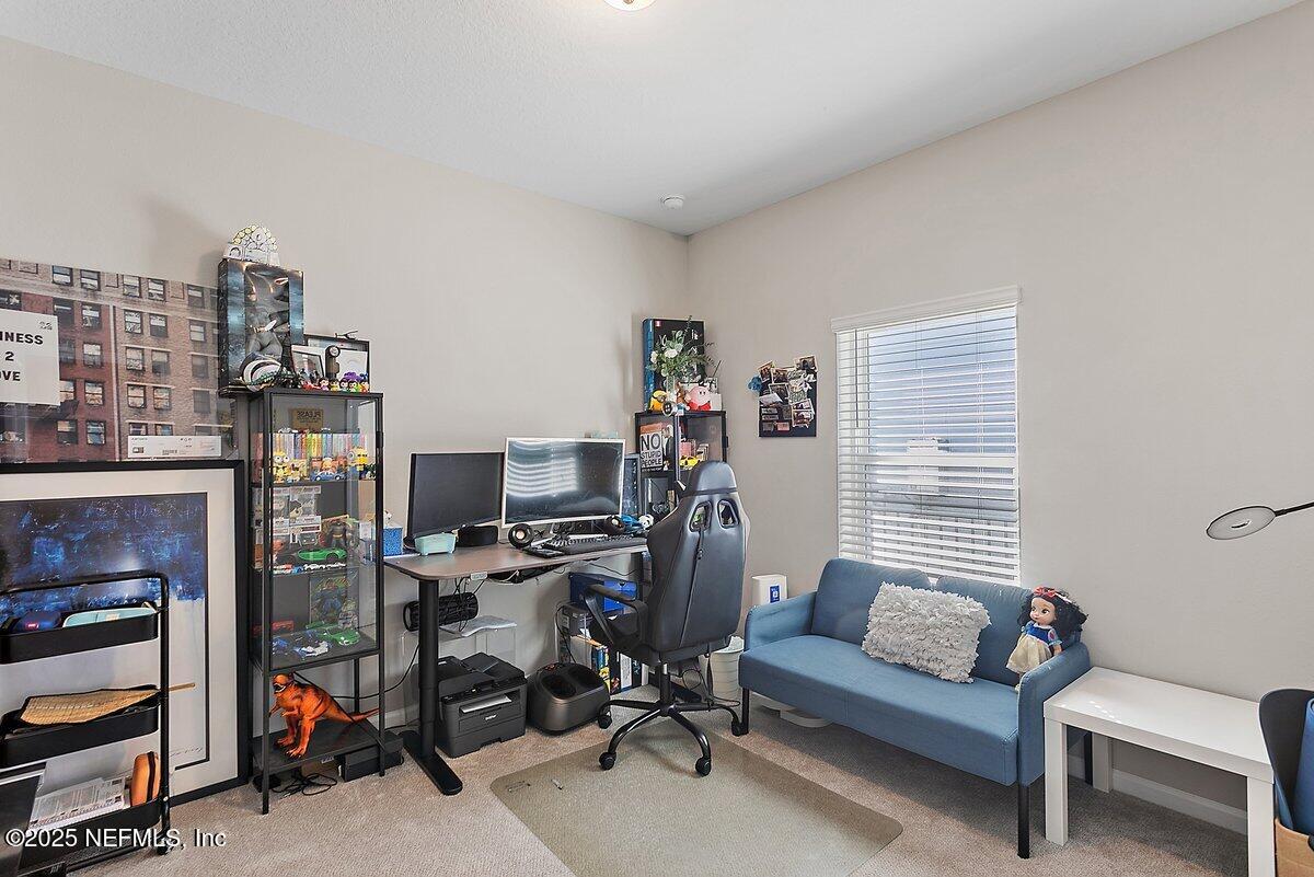367 Brookgreen Way St. Augustine, FL 32092 - Photo 12 of 27 a view of a workspace with furniture and a window