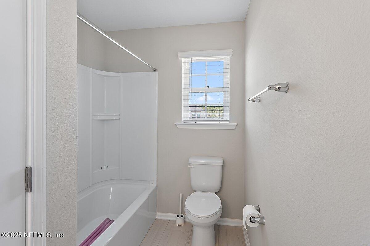 367 Brookgreen Way St. Augustine, FL 32092 - Photo 15 of 27 a white toilet sitting next to a bath tub