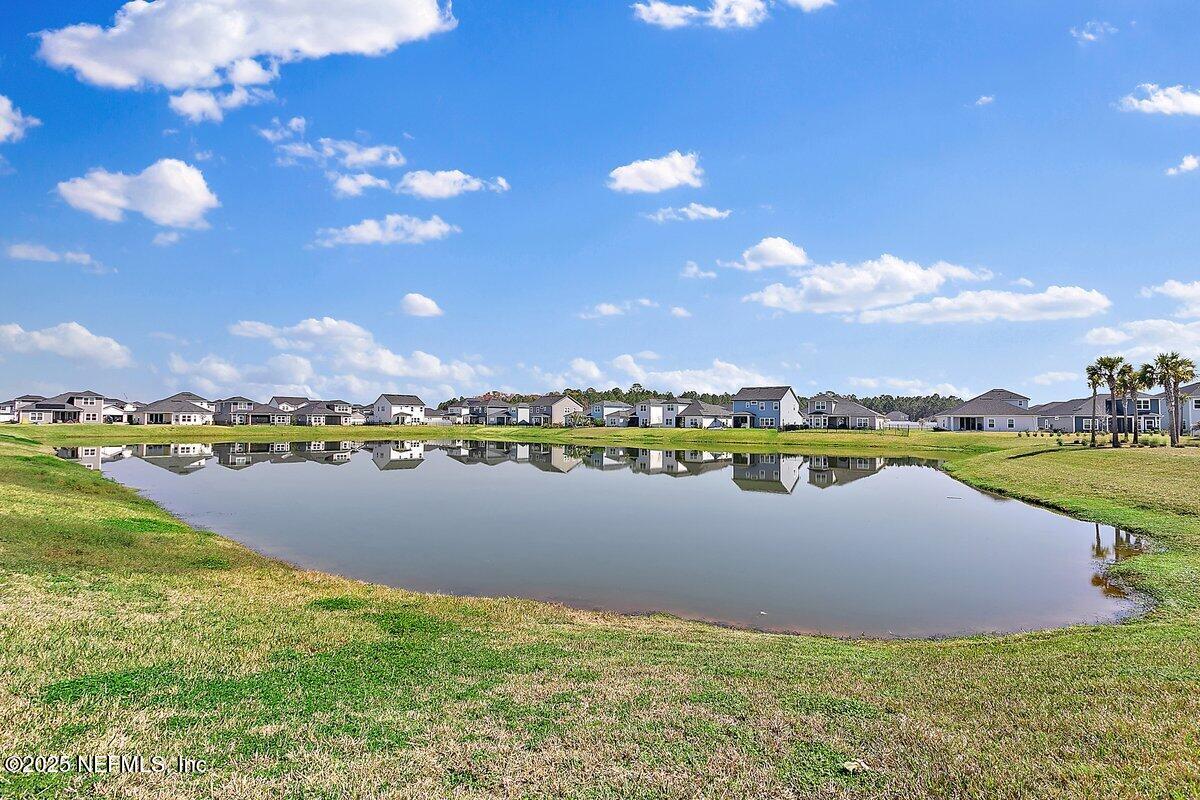 367 Brookgreen Way St. Augustine, FL 32092 - Photo 18 of 27 a view of a lake with houses in the back