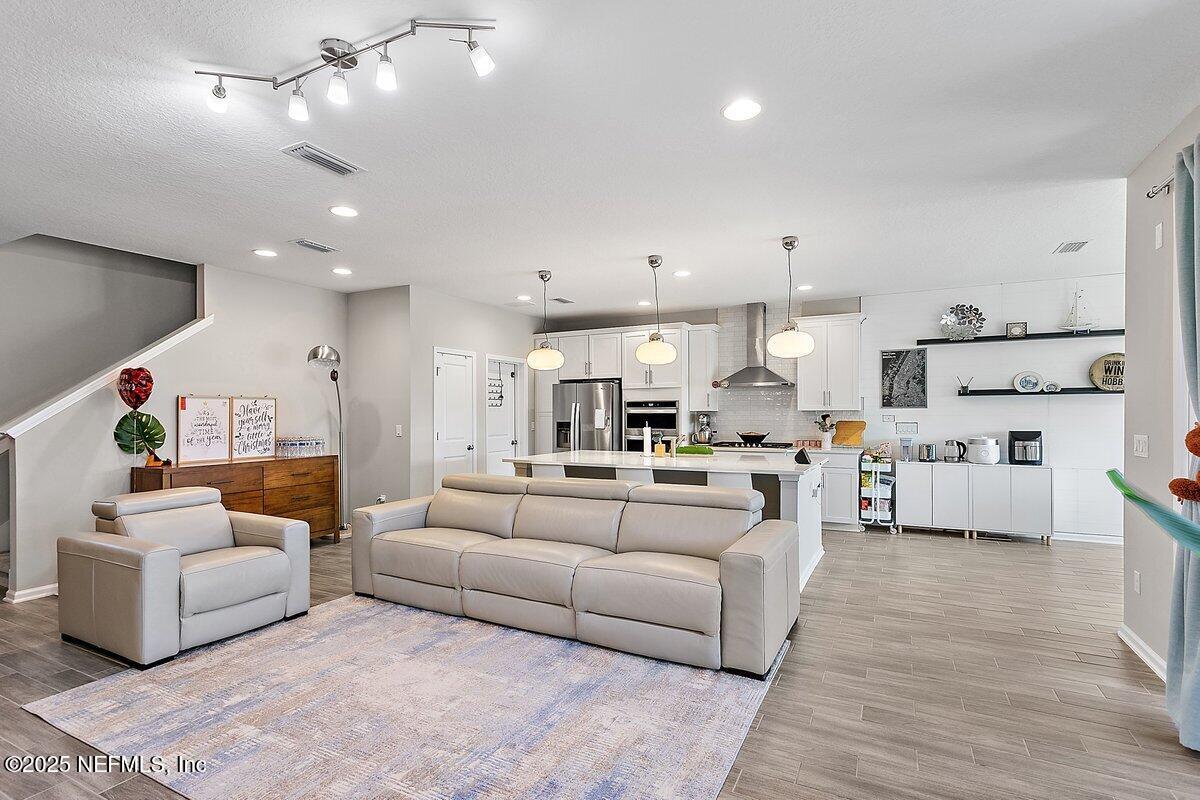 367 Brookgreen Way St. Augustine, FL 32092 - Photo 4 of 27 a living room with furniture and kitchen view