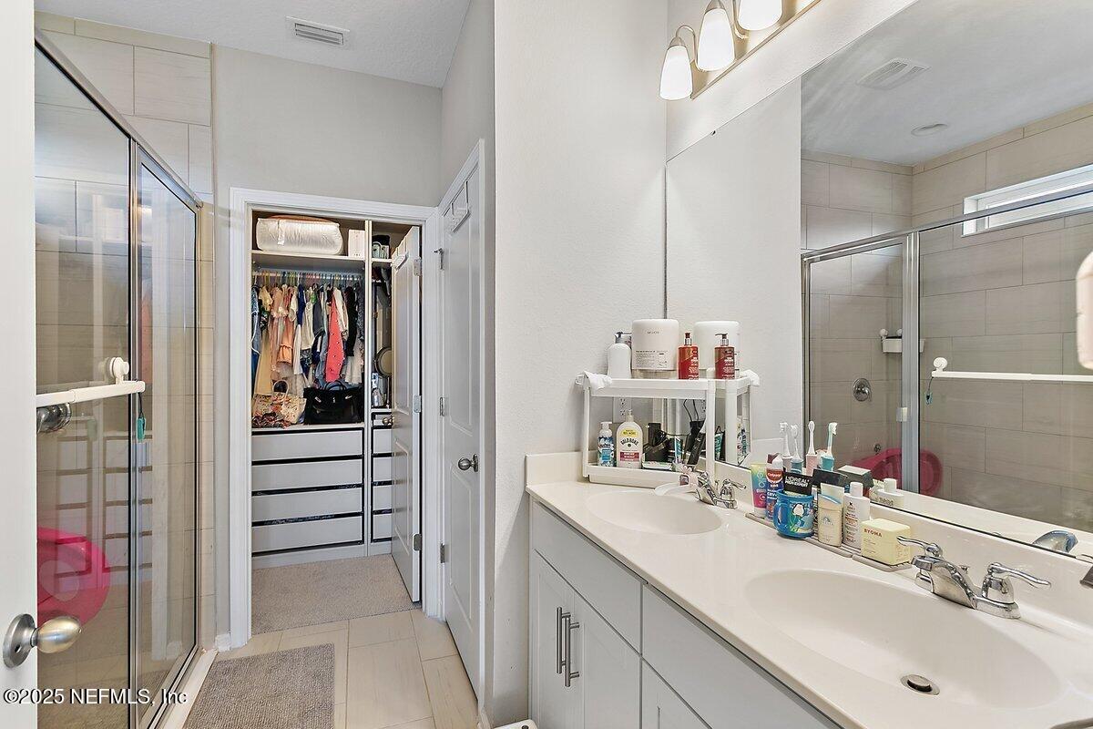 367 Brookgreen Way St. Augustine, FL 32092 - Photo 9 of 27 a bathroom with a sink and a mirror