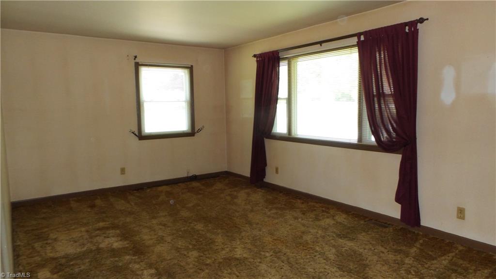 Living room with large window for natural light.