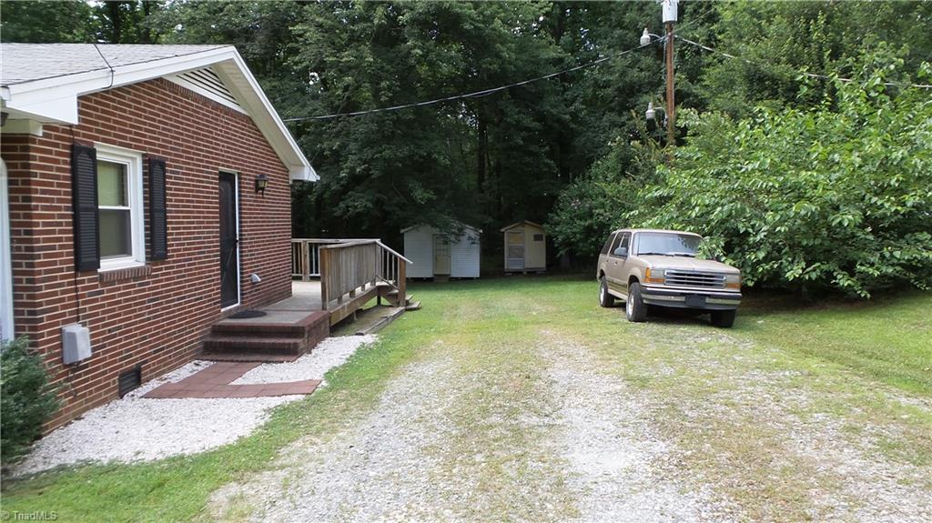 2107 Scott Road Browns Summit, NC 27214 - Photo 24 of 28 Driveway & side entrance to home