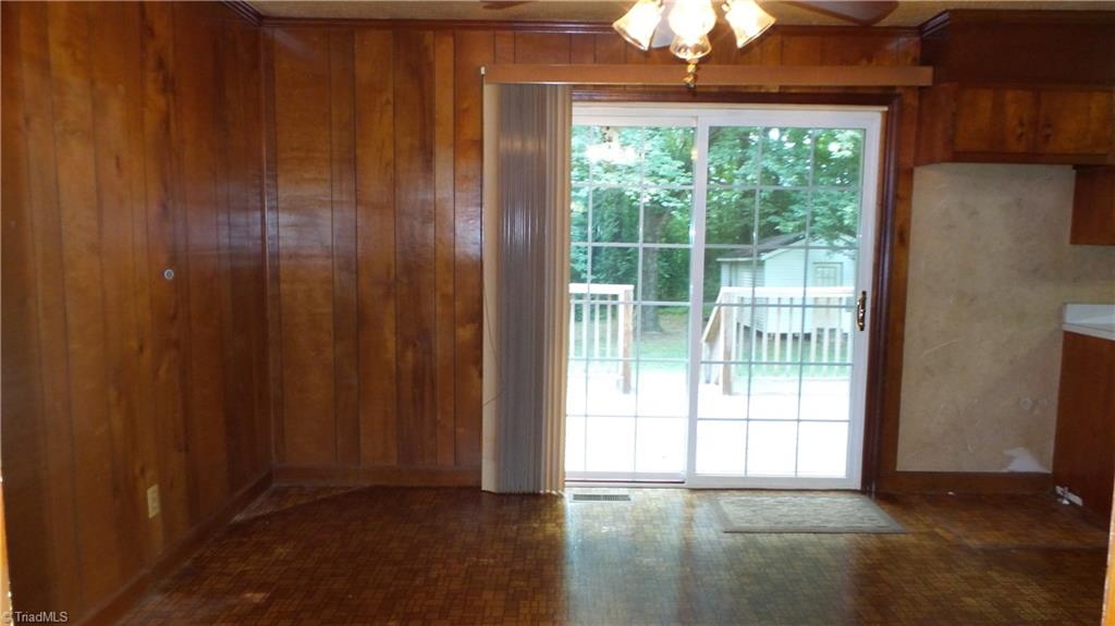 2107 Scott Road Browns Summit, NC 27214 - Photo 9 of 28 Dining area with entrance to back deck