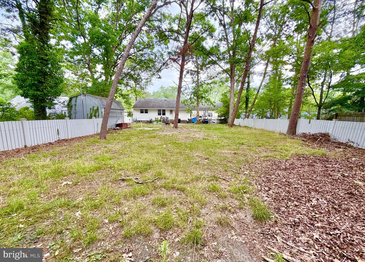2413 Shelburn Road Millville, NJ 08332 - Photo 34 of 41 a house with trees in front of it