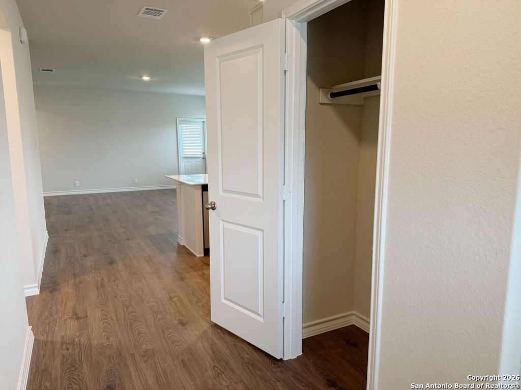 607 Fluted Cibolo, TX 78108 - Photo 11 of 50 a view of a hallway with wooden floor