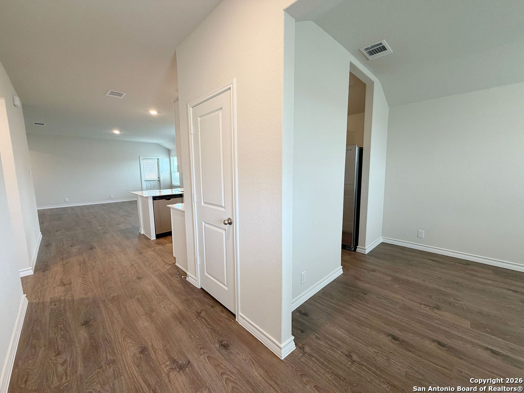 607 Fluted Cibolo, TX 78108 - Photo 12 of 50 a view of a hallway with wooden floor