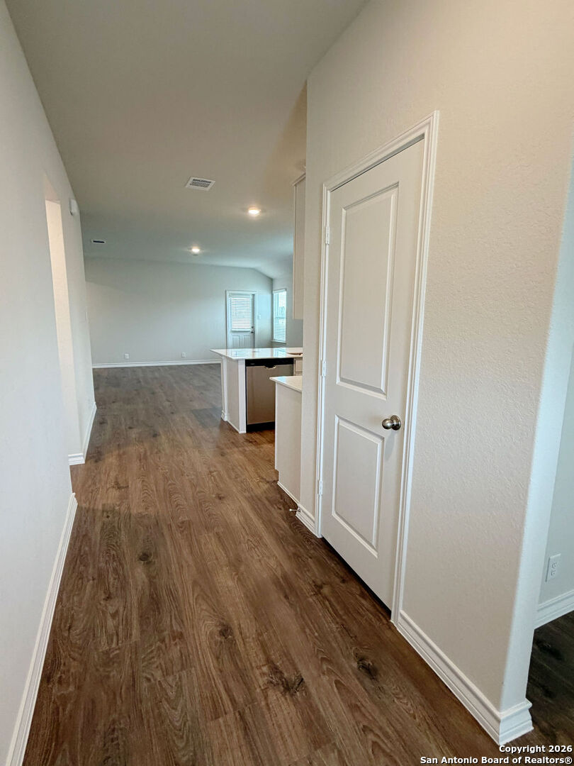 607 Fluted Cibolo, TX 78108 - Photo 13 of 50 a view of a kitchen from the hallway