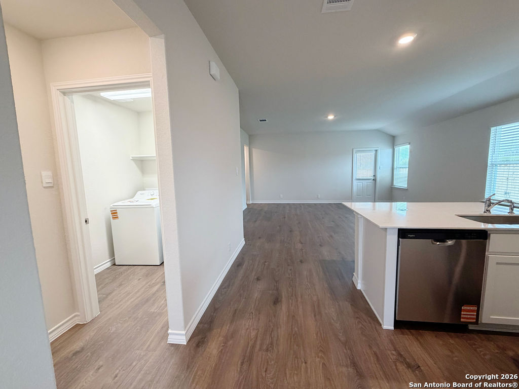 607 Fluted Cibolo, TX 78108 - Photo 17 of 50 a view of a kitchen from the hallway