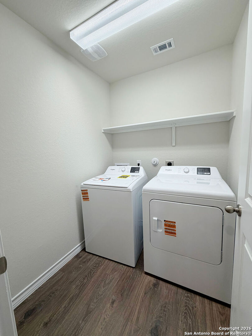 607 Fluted Cibolo, TX 78108 - Photo 18 of 50 a utility room with dryer and washer