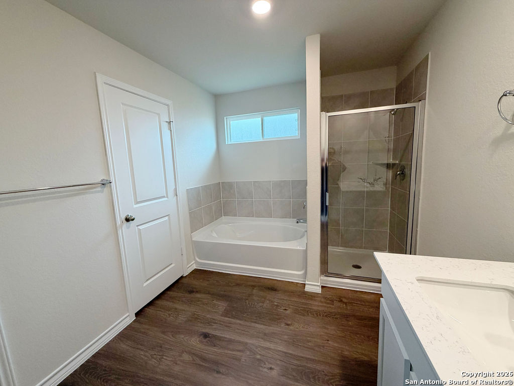 607 Fluted Cibolo, TX 78108 - Photo 32 of 50 a bathroom with a tub and shower