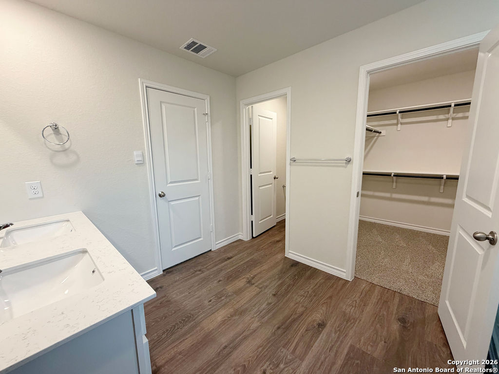 607 Fluted Cibolo, TX 78108 - Photo 34 of 50 a view of storage and utility room in wooden floor