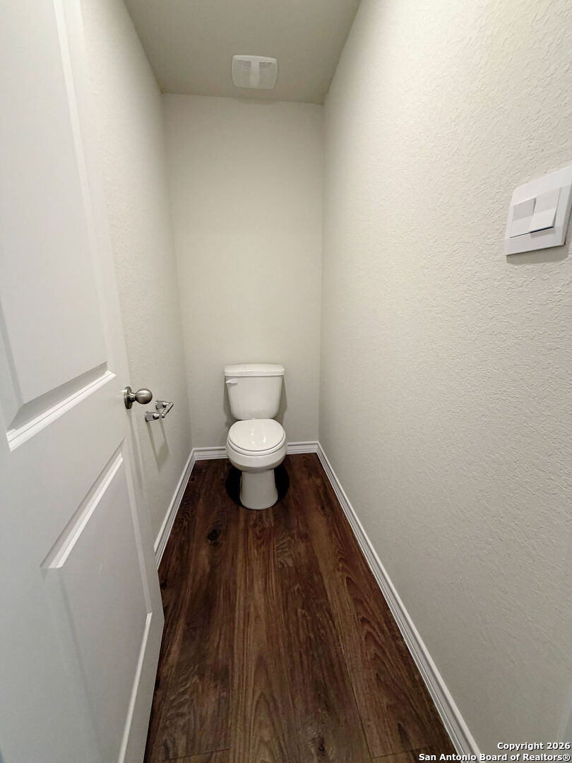 607 Fluted Cibolo, TX 78108 - Photo 35 of 50 a bathroom with a toilet and a sink