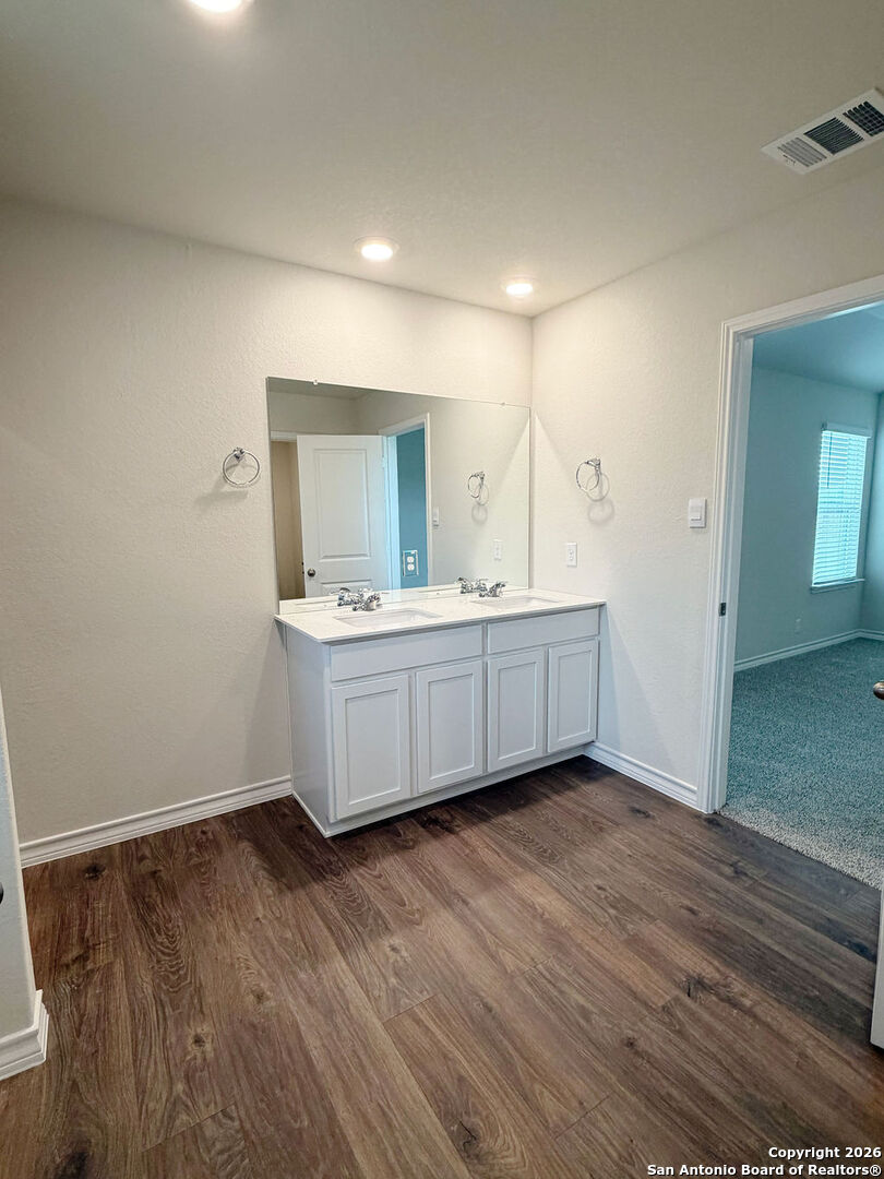 607 Fluted Cibolo, TX 78108 - Photo 39 of 50 a view of a room with wooden floor and sink