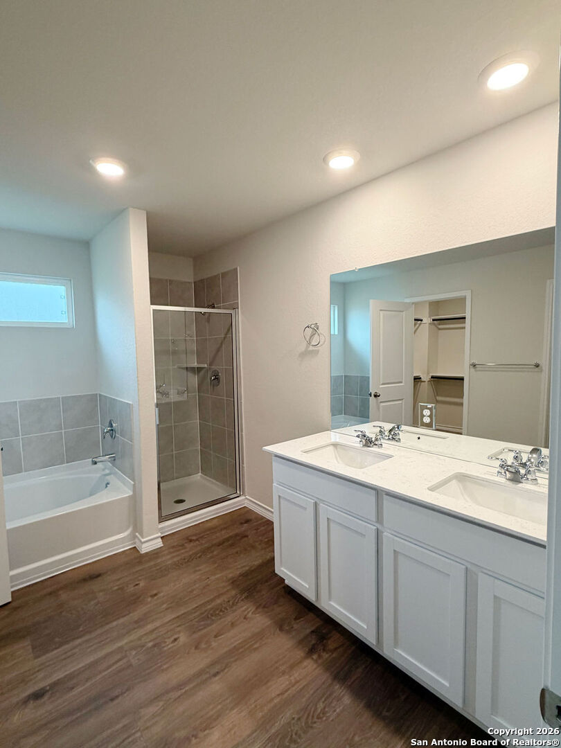 607 Fluted Cibolo, TX 78108 - Photo 41 of 50 a bathroom with a double vanity sink mirror double and bathtub