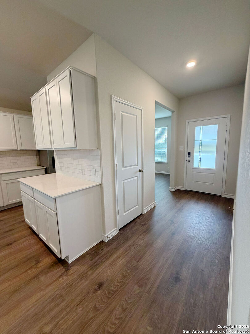 607 Fluted Cibolo, TX 78108 - Photo 6 of 50 a living room with hard wood floors and kitchen view