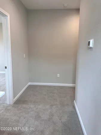 a view of a room with yard from a window