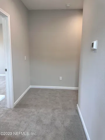 a view of a room with yard from a window