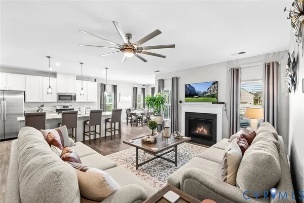 a living room with furniture and a fireplace