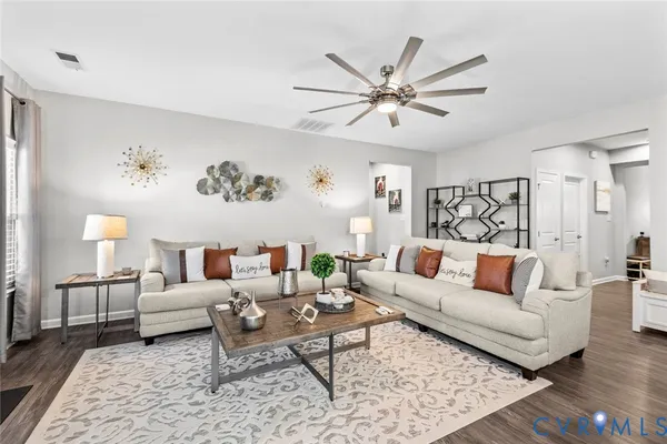 a living room with furniture and a rug