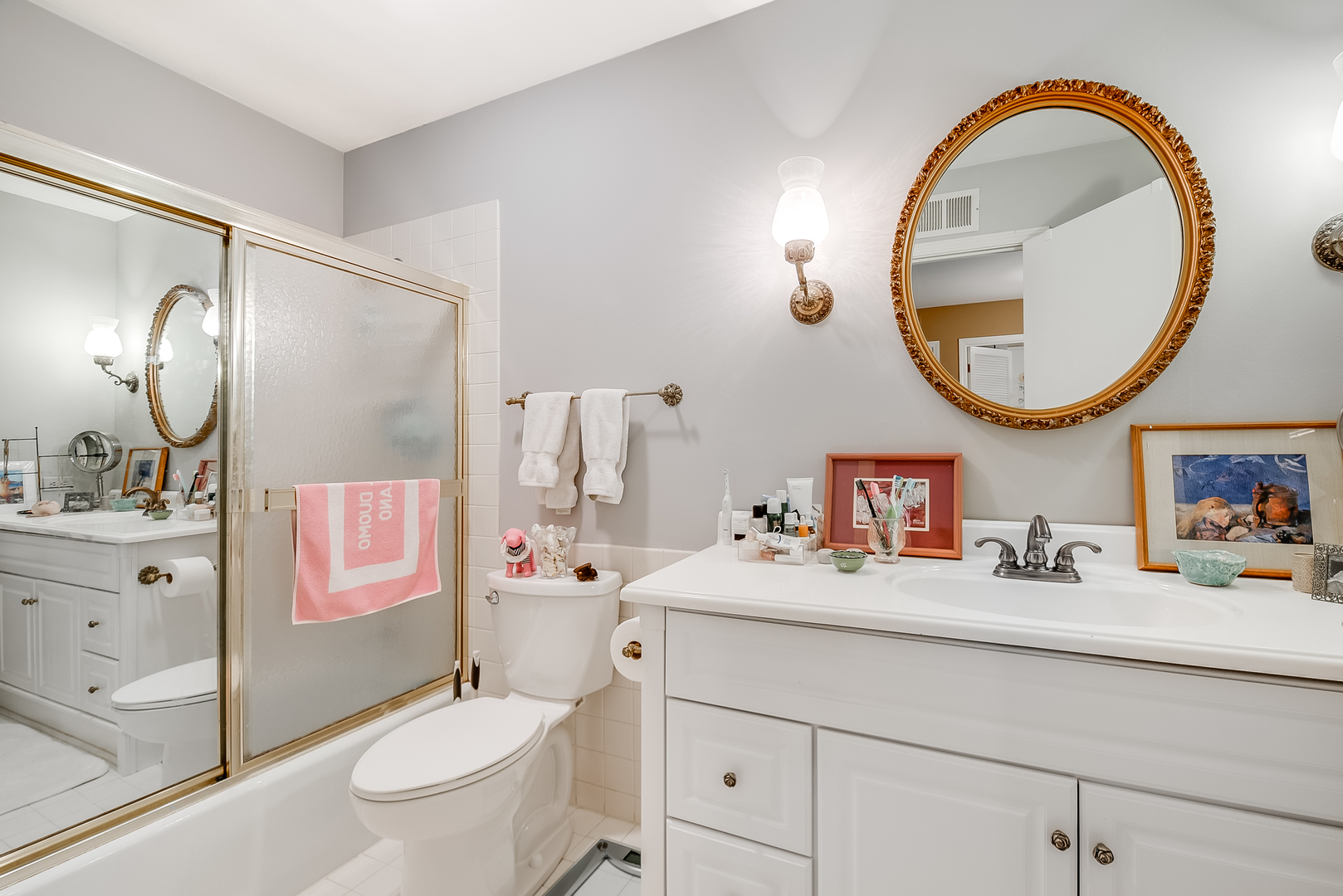 731 Raleigh Court Northbrook, IL 60062 - Photo 13 of 23 a bathroom with a sink a mirror a toilet and a mirror