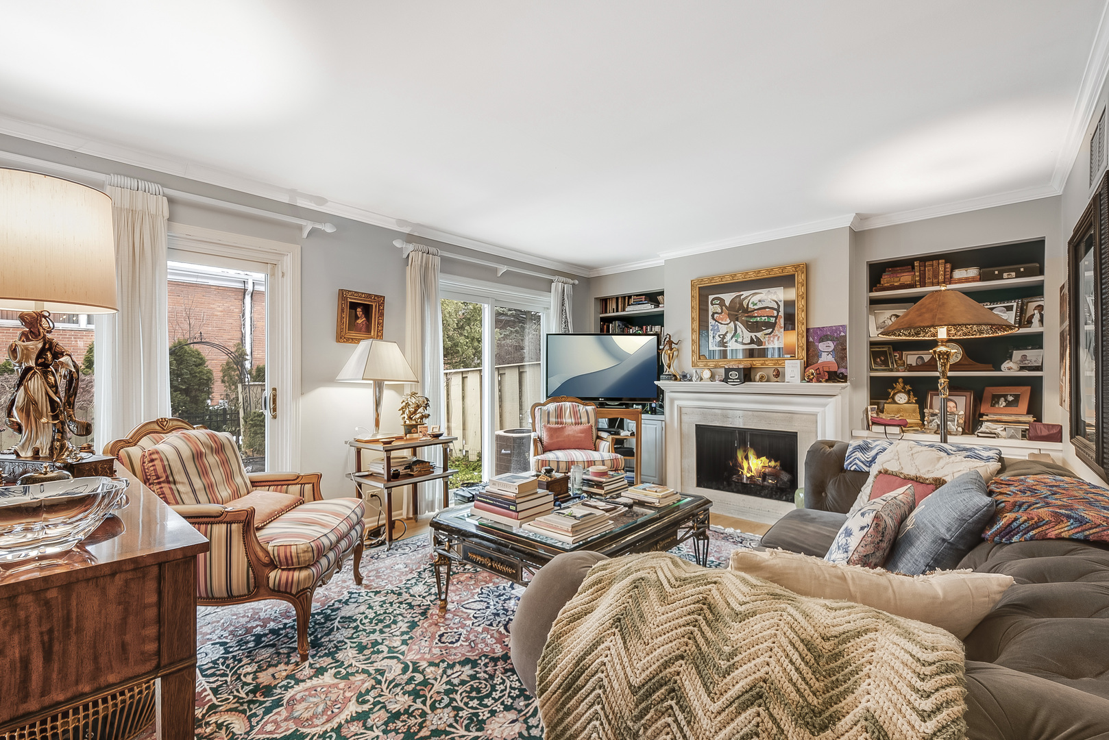 731 Raleigh Court Northbrook, IL 60062 - Photo 2 of 23 a living room with furniture large window and a fireplace