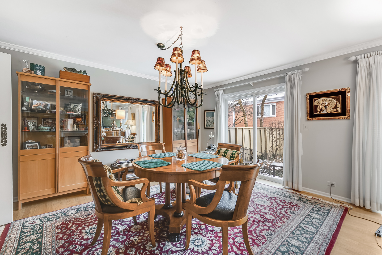 731 Raleigh Court Northbrook, IL 60062 - Photo 3 of 23 a dining room with furniture a chandelier and wooden floor