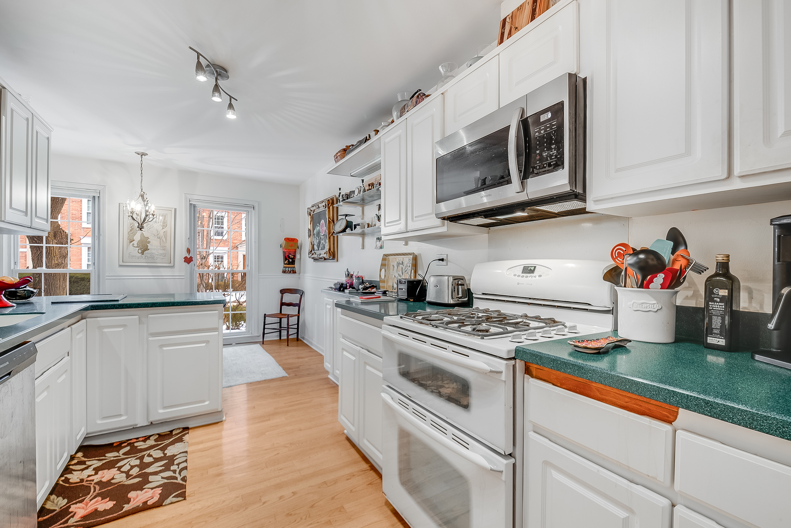 731 Raleigh Court Northbrook, IL 60062 - Photo 5 of 23 a kitchen with stainless steel appliances granite countertop a sink and cabinets