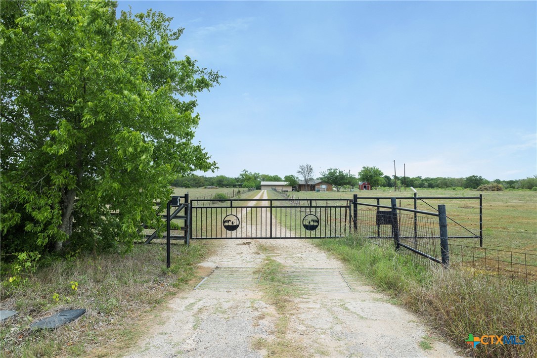 9765 State Park Road Lockhart, TX 78644 - Photo 28 of 40 a view of a lake with a house in the background