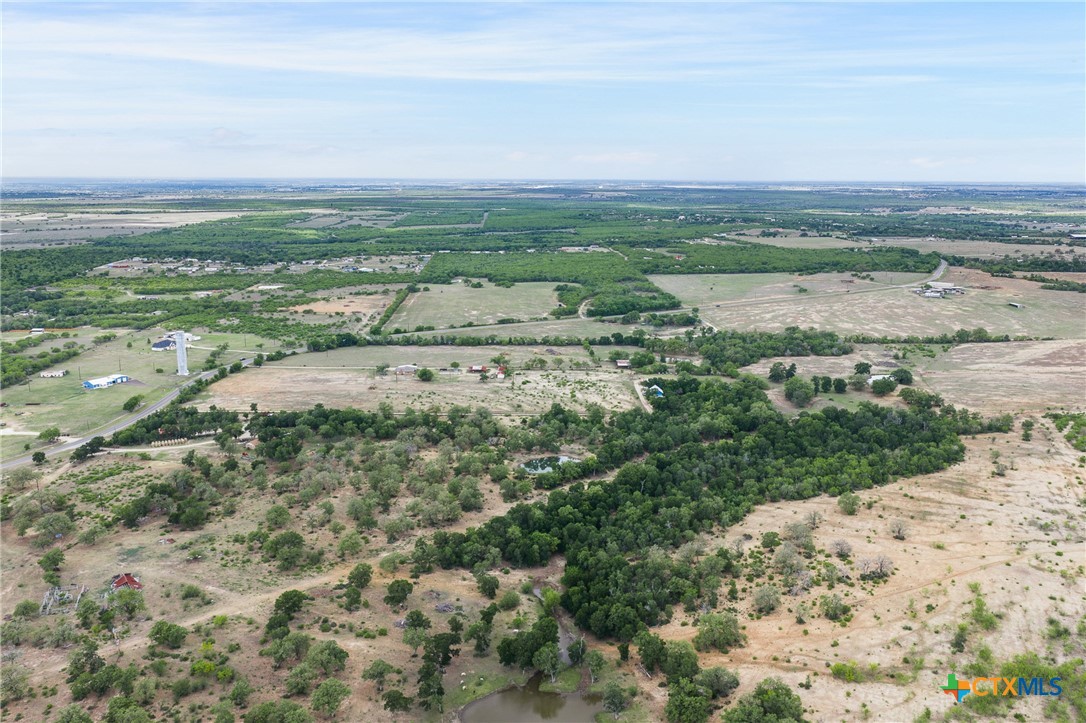 9765 State Park Road Lockhart, TX 78644 - Photo 34 of 40 a view of a lake with beach and city view