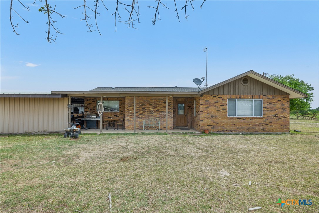 9765 State Park Road Lockhart, TX 78644 - Photo 5 of 40 a view of a house with a yard and sitting area