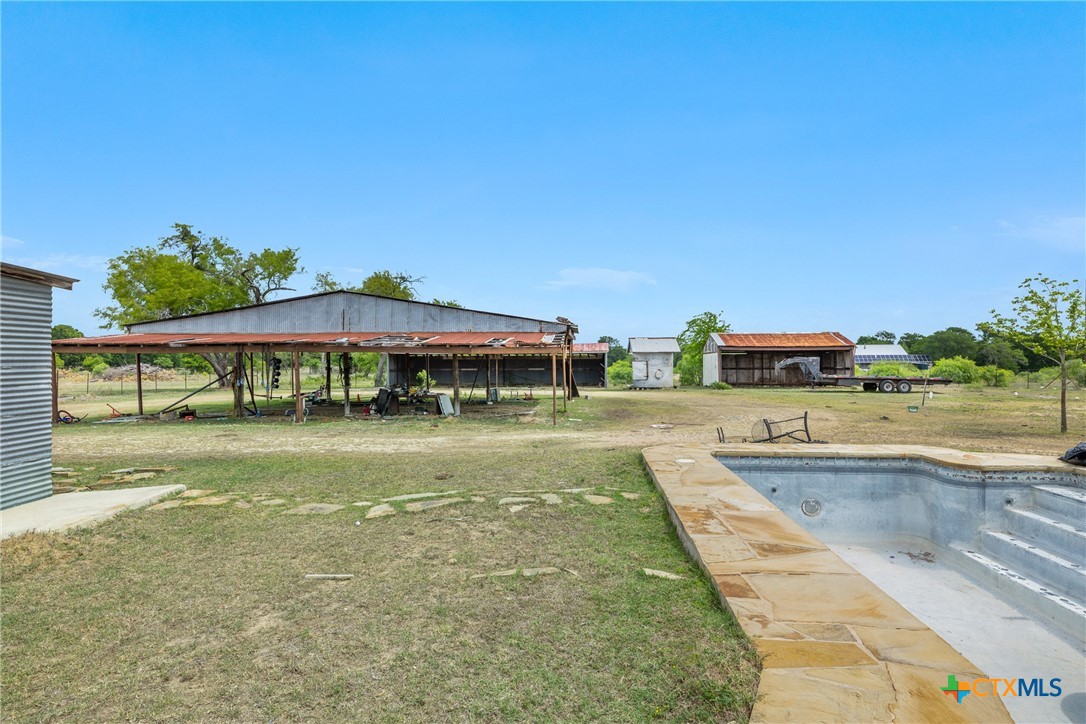 9765 State Park Road Lockhart, TX 78644 - Photo 10 of 40 a view of a house with a yard